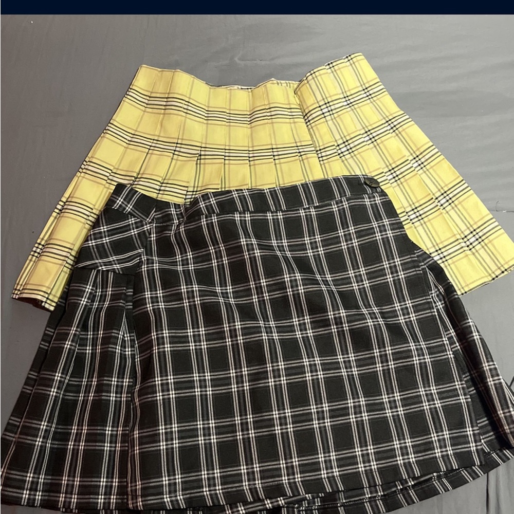 Two skirts come together, schoolgirl skirts